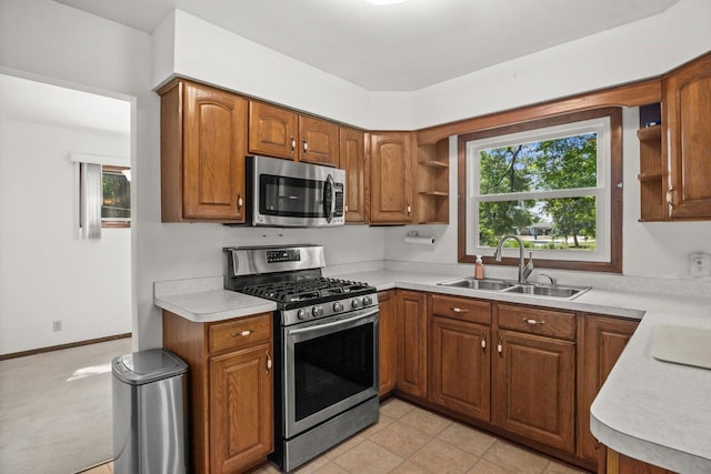 308 Long Ave, North Aurora, IL 60542 - kitchen with stainless steel appliances, open shelves, light countertops, and brown cabinets