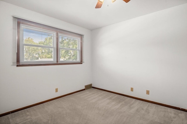 308 Long Ave, North Aurora, IL 60542 - spare room featuring light colored carpet and ceiling fan