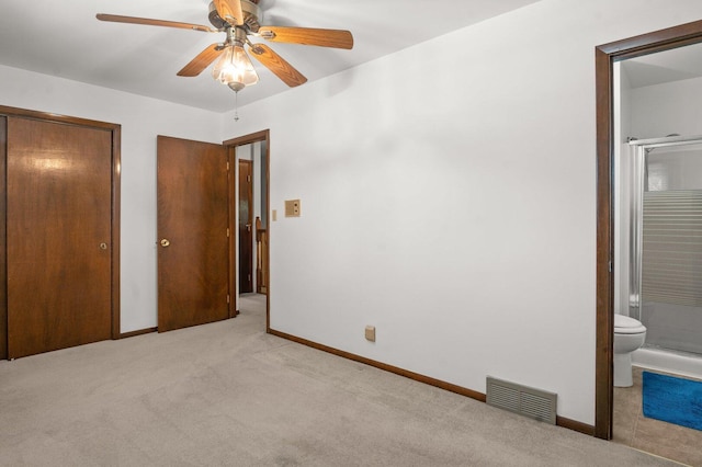 308 Long Ave, North Aurora, IL 60542 - unfurnished bedroom featuring light colored carpet, a closet, ensuite bath, and a ceiling fan
