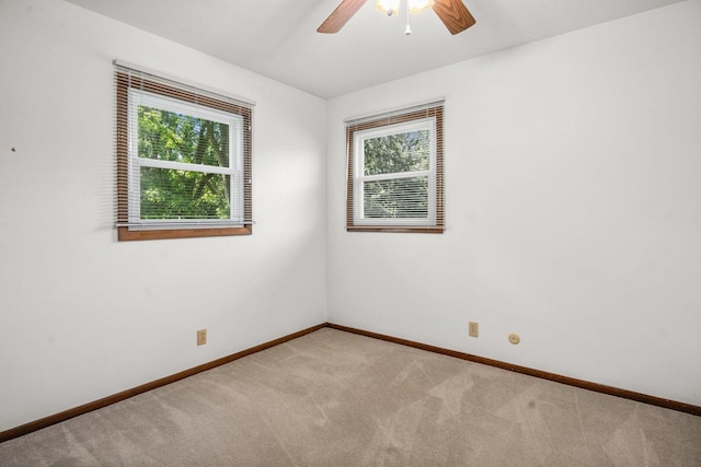 308 Long Ave, North Aurora, IL 60542 - empty room featuring plenty of natural light, light colored carpet, and ceiling fan