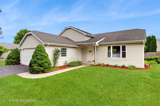 view of front of home featuring a garage, driveway, and roof with shingles