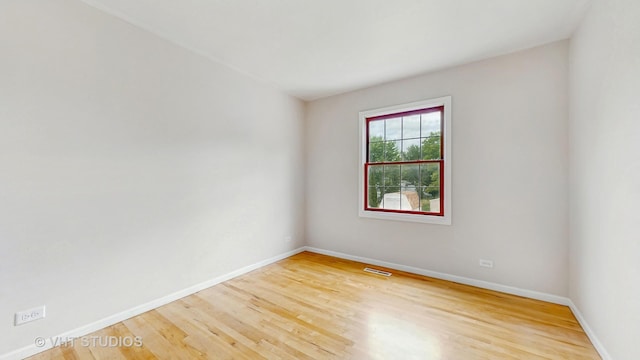 empty room featuring wood finished floors