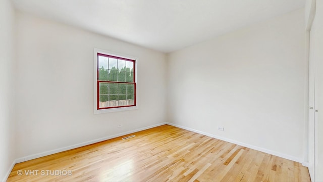 1828 Wicker St, Woodstock, IL 60098 - empty room with baseboards and wood finished floors