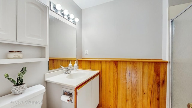bathroom featuring an enclosed shower and vanity