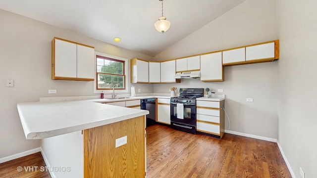 1828 Wicker St, Woodstock, IL 60098 - kitchen featuring black appliances, under cabinet range hood, a peninsula, white cabinetry, and light countertops