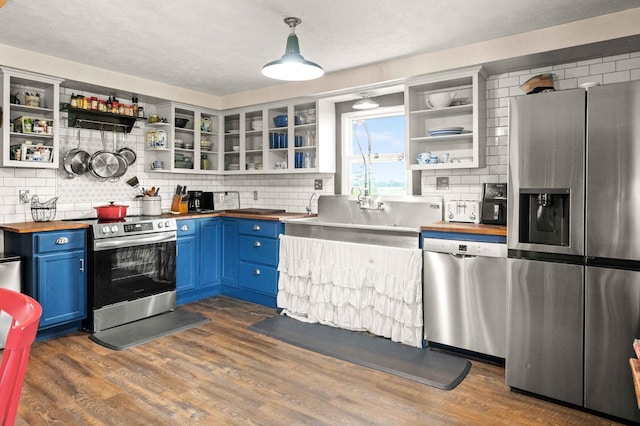 28231 US Highway 150, Leroy, IL 61752 - kitchen featuring appliances with stainless steel finishes, open shelves, wood counters, and blue cabinets