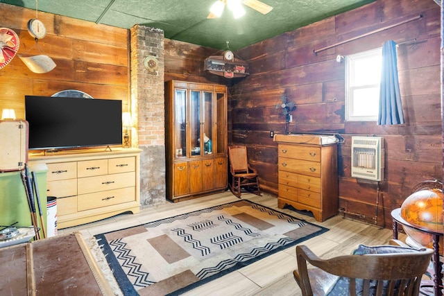 28231 US Highway 150, Leroy, IL 61752 - bedroom with heating unit, wood walls, and light wood-style flooring