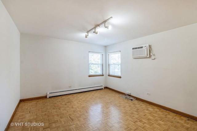 837 N Harlem Ave Unit 2N, Oak Park, IL 60302 - spare room with a baseboard heating unit, a wall mounted AC, and rail lighting
