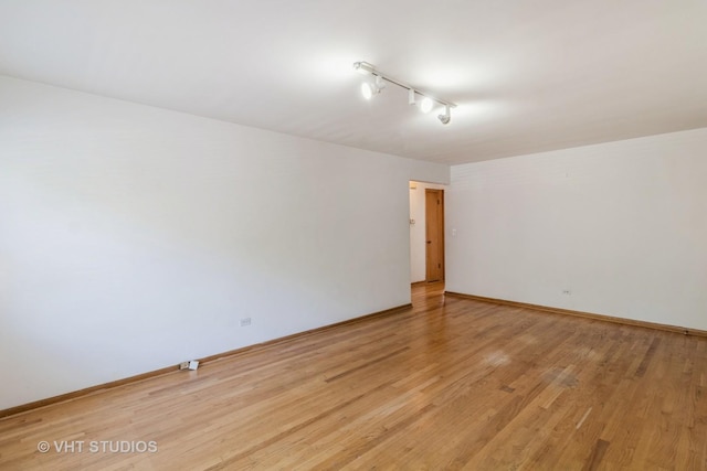 837 N Harlem Ave Unit 2N, Oak Park, IL 60302 - unfurnished room with light wood-style flooring and baseboards