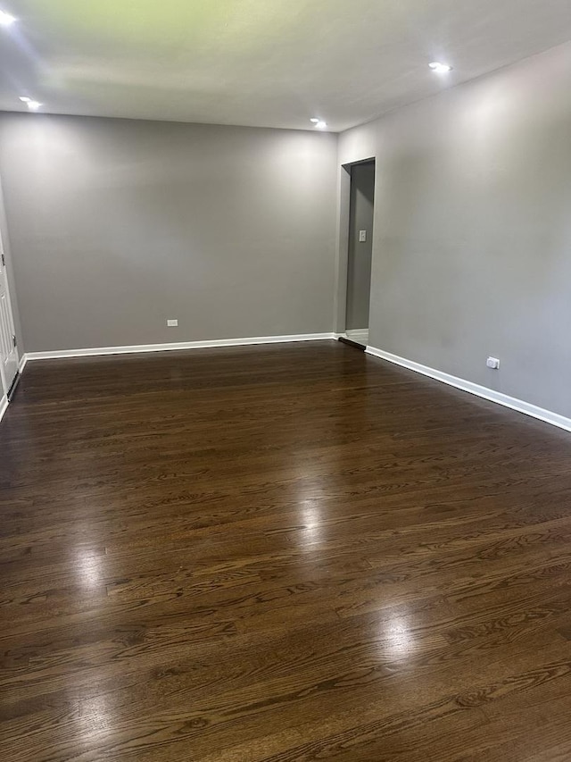 933 E 142nd St, Dolton, IL 60419 - spare room featuring dark wood-type flooring and recessed lighting