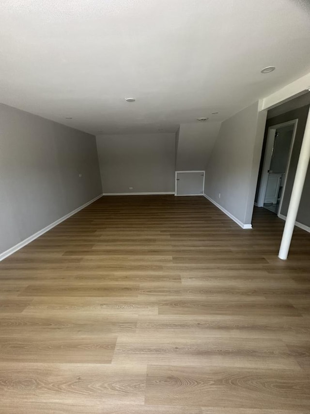 933 E 142nd St, Dolton, IL 60419 - spare room with wood finished floors and lofted ceiling