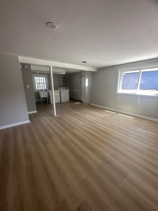 933 E 142nd St, Dolton, IL 60419 - unfurnished living room with washer and dryer and wood finished floors