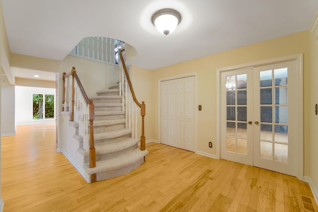 1234 Will Dr, Lockport, IL 60441 - entrance foyer with wood finished floors, french doors, and stairway