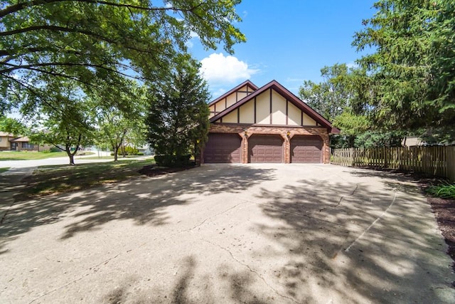 1234 Will Dr, Lockport, IL 60441 - tudor house with driveway and a garage