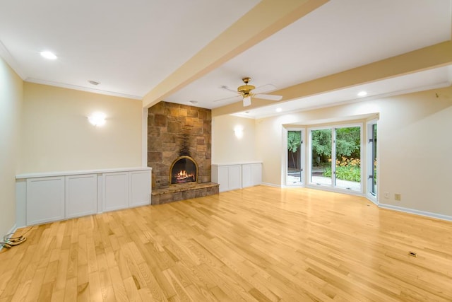 1234 Will Dr, Lockport, IL 60441 - unfurnished living room with light wood-style floors, ceiling fan, ornamental molding, a stone fireplace, and recessed lighting