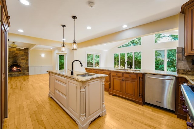 1234 Will Dr, Lockport, IL 60441 - kitchen with dishwasher, a fireplace, light wood-style floors, light stone countertops, and recessed lighting