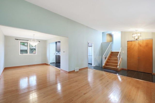 9043 Oriole Ave, Morton Grove, IL 60053 - view of property hidden behind natural elements featuring stucco siding, a detached garage, a front yard, and an outdoor structure