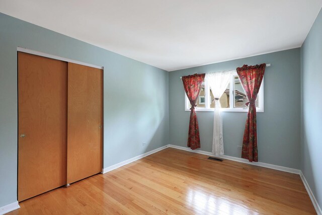 9043 Oriole Ave, Morton Grove, IL 60053 - empty room featuring light wood-type flooring