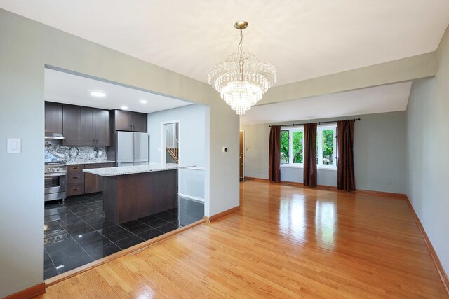 9043 Oriole Ave, Morton Grove, IL 60053 - kitchen featuring dishwasher, dark tile patterned floors, backsplash, a chandelier, and recessed lighting