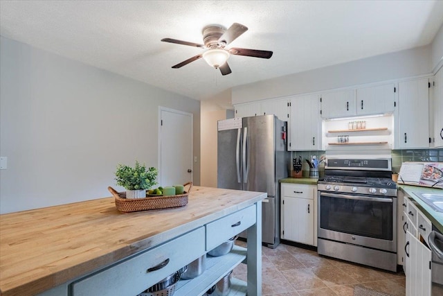 107 S Regency Dr, Bloomington, IL 61701 - kitchen featuring appliances with stainless steel finishes, ceiling fan, white cabinetry, and wooden counters