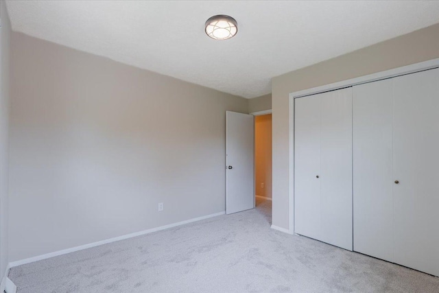 107 S Regency Dr, Bloomington, IL 61701 - unfurnished bedroom featuring carpet and a closet