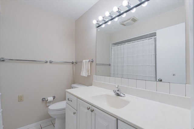 107 S Regency Dr, Bloomington, IL 61701 - bathroom featuring tile patterned floors and vanity