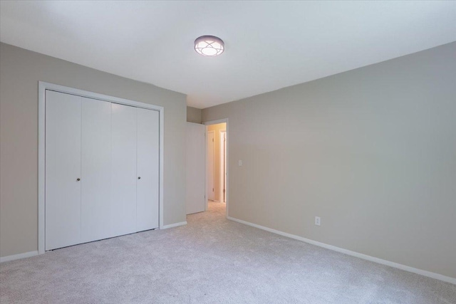 107 S Regency Dr, Bloomington, IL 61701 - unfurnished bedroom with carpet flooring and a closet