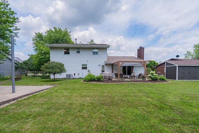107 S Regency Dr, Bloomington, IL 61701 - rear view of property with a patio area and a chimney
