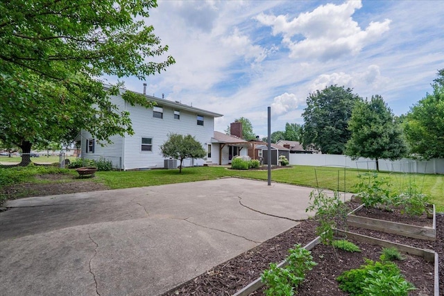 107 S Regency Dr, Bloomington, IL 61701 - rear view of property with a garden and a patio area