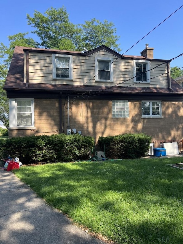 1860 Belleview Ave, Westchester, IL 60154 - view of front of property with a front lawn, brick siding, and a chimney