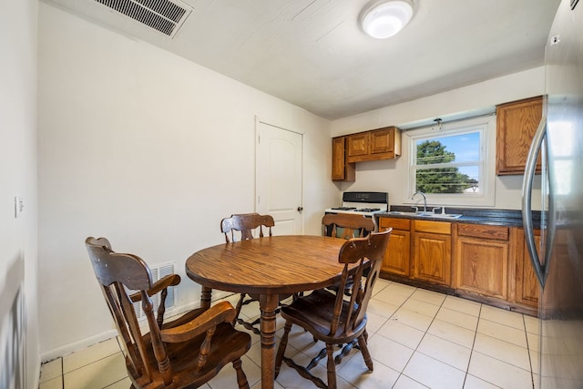 8116 Leamington St, Burbank, IL 60459 - dining area with light tile patterned floors