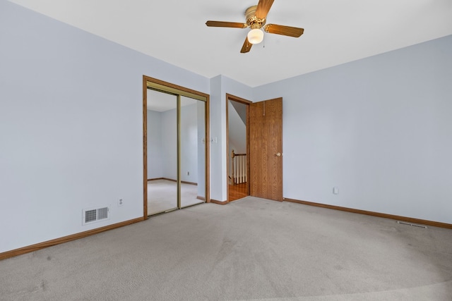 15893 Aime Ln, Wadsworth, IL 60083 - unfurnished bedroom with carpet, a closet, and ceiling fan