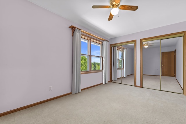 15893 Aime Ln, Wadsworth, IL 60083 - unfurnished bedroom with two closets, carpet floors, and ceiling fan