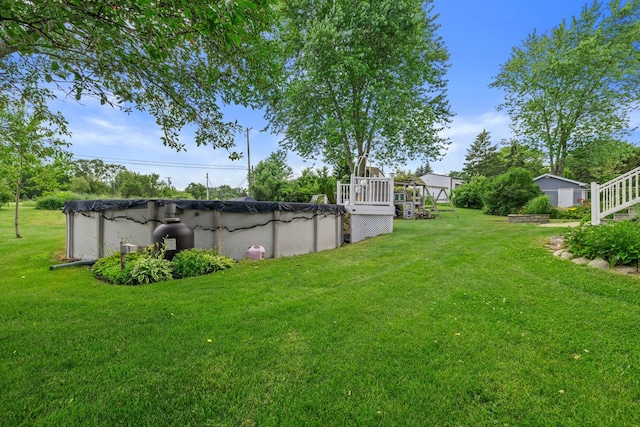 15893 Aime Ln, Wadsworth, IL 60083 - view of grassy yard with a covered pool and a deck