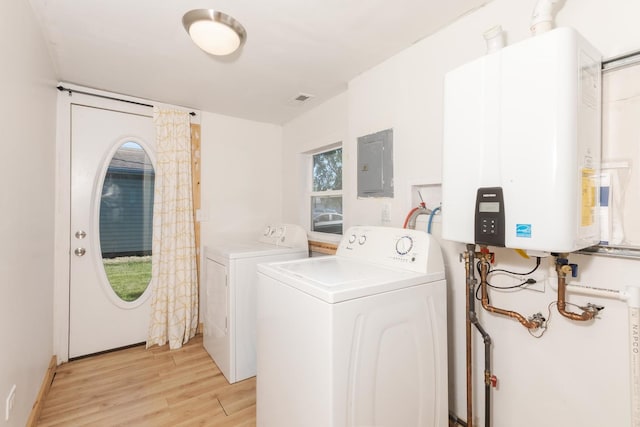 411 E Mazon St, Gardner, IL 60424 - laundry area featuring water heater, washer and clothes dryer, electric panel, and light wood-style floors