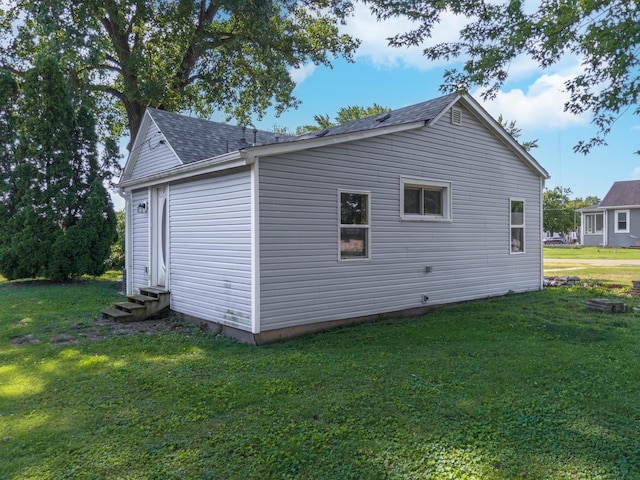 411 E Mazon St, Gardner, IL 60424 - view of home's exterior with entry steps, a yard, and roof with shingles