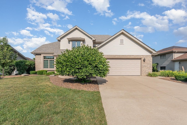 641 Downing St, New Lenox, IL 60451 - view of front of home with brick siding, concrete driveway, a front lawn, and a garage
