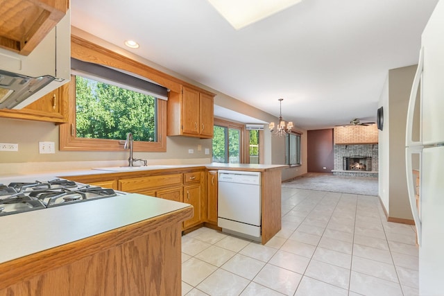 641 Downing St, New Lenox, IL 60451 - kitchen with white appliances, a peninsula, light tile patterned flooring, and open floor plan