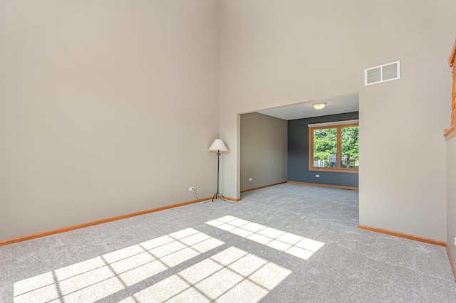 641 Downing St, New Lenox, IL 60451 - carpeted spare room with baseboards and a high ceiling
