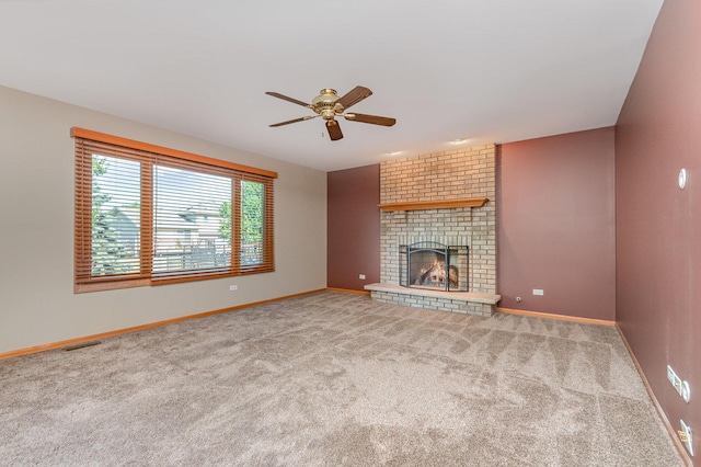 641 Downing St, New Lenox, IL 60451 - unfurnished living room featuring ceiling fan, carpet flooring, and a fireplace