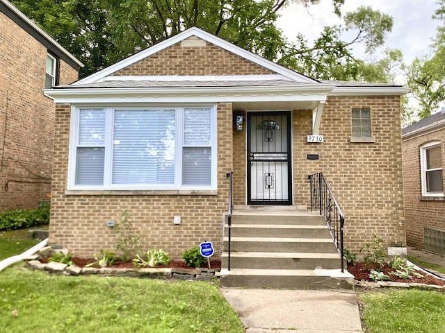 view of front of home with brick siding