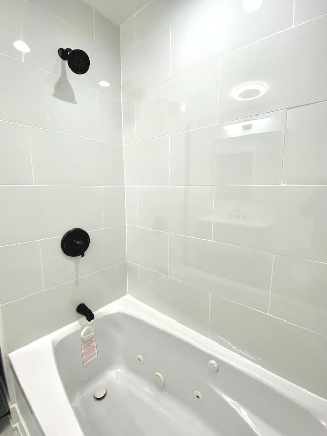 full bathroom featuring a combined bath / shower with jetted tub