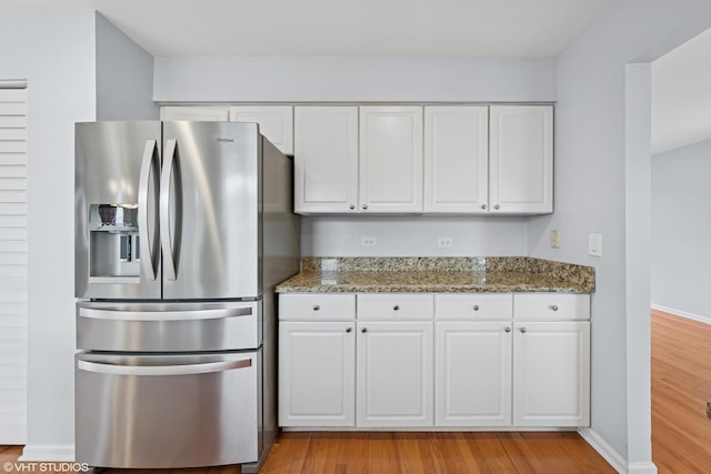 474 Wildflower Way, Bolingbrook, IL 60440 - kitchen featuring stainless steel fridge, white cabinets, light stone counters, and light wood-style floors