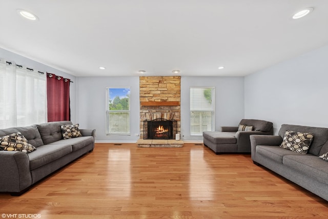 474 Wildflower Way, Bolingbrook, IL 60440 - living area featuring plenty of natural light, light wood-style floors, a stone fireplace, and recessed lighting