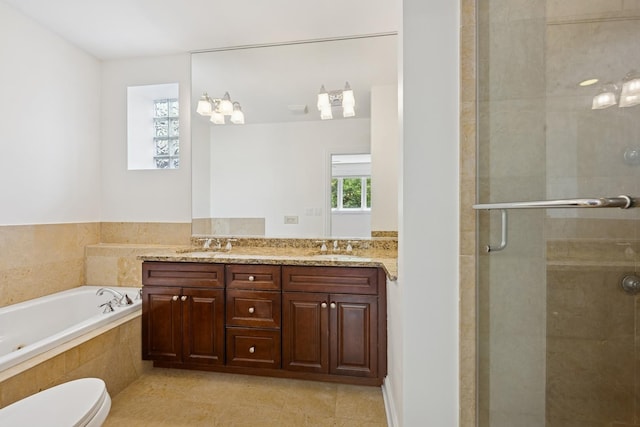 1701 N Washtenaw Ave Unit 1E, Chicago, IL 60647 - full bathroom with a shower stall, double vanity, a garden tub, and tile patterned floors