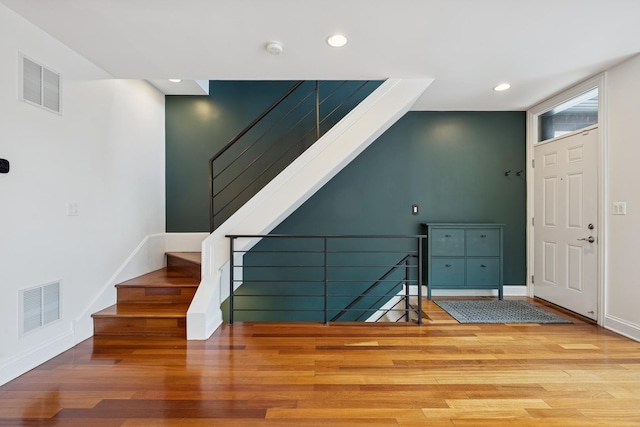 1701 N Washtenaw Ave Unit 1E, Chicago, IL 60647 - entrance foyer with recessed lighting, wood finished floors, and stairway