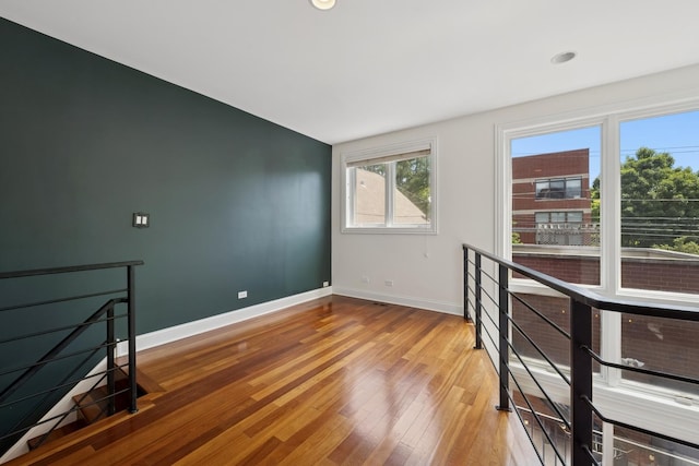 1701 N Washtenaw Ave Unit 1E, Chicago, IL 60647 - empty room featuring baseboards and light wood-style flooring