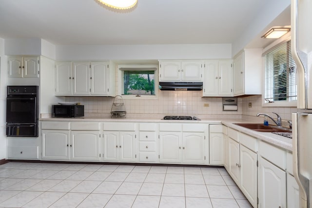874 Hillandale Dr, Antioch, IL 60002 - kitchen featuring black appliances, a warming drawer, under cabinet range hood, and decorative backsplash