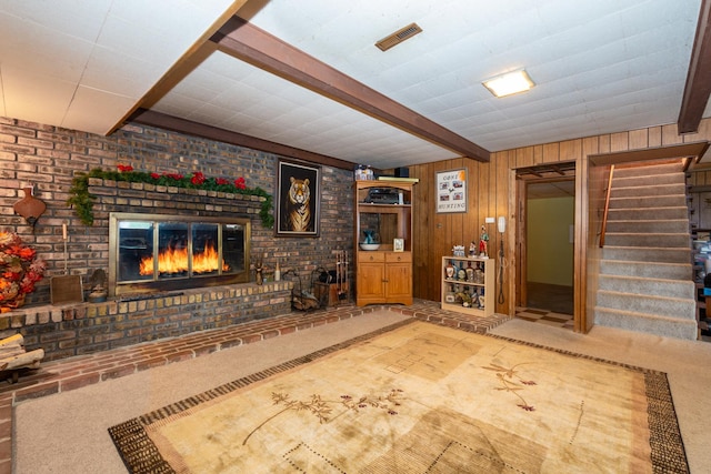 874 Hillandale Dr, Antioch, IL 60002 - carpeted living area with beam ceiling, stairway, a brick fireplace, and wood walls