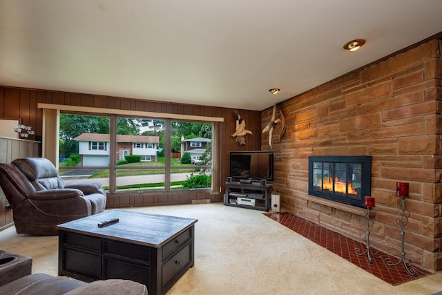 874 Hillandale Dr, Antioch, IL 60002 - living area featuring light colored carpet, wooden walls, and a stone fireplace